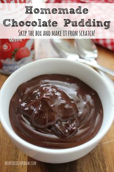 homemade chocolate pudding in a white bowl on a wooden table