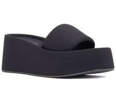 Slide into the season with the Uproar wedge sandal, where comfort meets effortless style. This chic sandal, featuring a padded footbed and upper along with a modern square-toe design, offers an updated take on the classic slide silhouette. Perfect for sunny days and warm evenings, it's an essential addition to your spring and summer wardrobe. From Olivia Miller. Black Wedge Sandals For Evening, Medium Width, Black Wedge Sandals With Cork-bed Midsoles For Vacation, Black Slip-on Wedge Sandals With Buckle, Black Slip-on Synthetic Wedge Sandals, Olivia Miller, Black Textured Sole Slip-on Wedge Sandals, Chic Sandals, Modern Square, Toe Designs