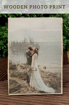 a wooden photo frame sitting on top of a table