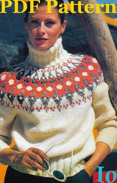 the woman is wearing a sweater with an ornament pattern on it and has her hands in her pockets