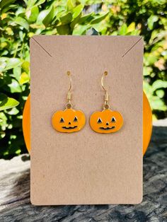 Lightweight enamel Jack O' Lantern Earrings. Wonderful to wear for Halloween, costume parties, or even just because. Nearly 1.25 inches long from hook to charm, they're small, petite, and cute! Lantern Earrings, Costume Parties, Just Because, Jack O Lantern, Costume Party, Halloween Costume, Etsy Earrings, Dangle Drop Earrings, Drop Earrings