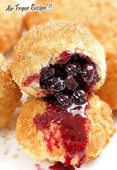 blueberry donut holes stacked on top of each other with jam in the middle