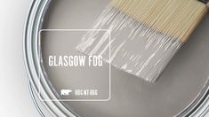 a paint can with a brush in it and the words glascow fog above it