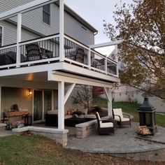 an outdoor living area with patio furniture and fire pit