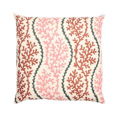 an orange and white pillow with coral print