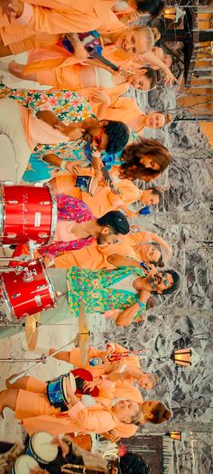 group of women standing next to each other with musical instruments