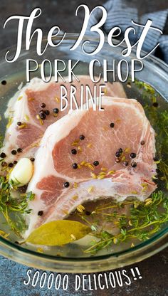 the best pork chop brine in a glass bowl with herbs and seasoning on top