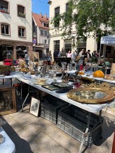 an outdoor flea market with lots of antique items