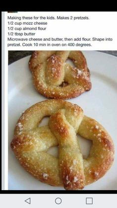 two pretzels sitting on top of a white plate