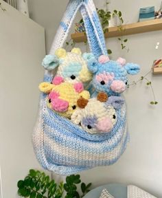 a crocheted purse with stuffed animals hanging from it