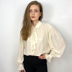 - Vintage cream white silk blouse with jabot - 100% silk - Very good condition - No size tags, please see measurements Measurements (laying flat): Shoulders: 47 cm / 18.5 inches  Armpit to armpit: 59 cm / 23.2 inches  Sleeve length: 64 cm / 25.2 inches  Length: 63 cm / 24.8 inches SHIPPING INFO Shipping price in the listing is for the "Standard Latvian post shipping". Includes tracking info and takes: * 5-7 business days within European Union * 10-15 business days to United States and Canada * U Poet Blouse, White Ruffle Blouse, White Silk Blouse, White Silk, Cream White, Silk Blouse, White Vintage, Womens Clothing Tops, Blouses For Women