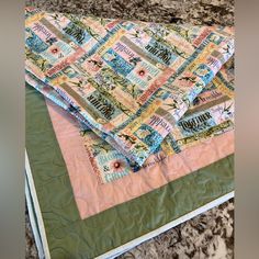 a quilted table runner on top of a granite countertop with the wording