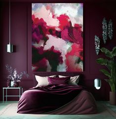 a large painting hanging above a bed in a room with purple walls and flooring