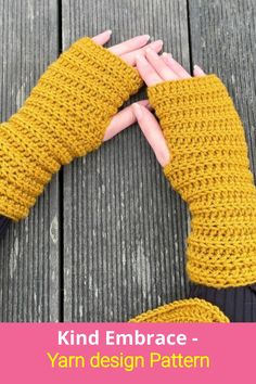 two hands in knitted mitts with the text kind embrace - yarn design pattern