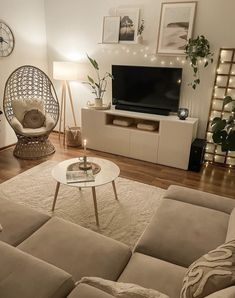 a living room filled with furniture and a flat screen tv