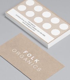 two business cards with polka dots on them, one for organics and the other for food