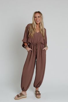 Excited to bring you the New Love Relaxed Drawstring Jumpsuit from our exclusive collection; The Nest by Three Bird Nest. Check out the rest of the collection here - Inspired by you, created by us. You'll get so many compliments in this one - piece because it features: Lightweight, slightly textured fabric Relaxed and loose jumpsuit silhouette Flattering v - neckline and open back detail with self - tie support strap Loose and wide kimono style sleeves Elastic, gathered, drawstring center waistb Drawstring Jumpsuit, Boho Essentials, Bralette Outfit, Three Bird Nest, Loose Jumpsuit, Comfy Pants, The Nest, Kimono Style, Bird Nest