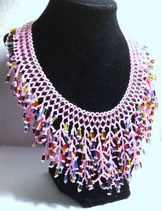 A handmade glass beaded necklace that is perfect for any occasion: parties, holidays, birthdays, anniversaries. All products are hand-crafted by my mother. Dimensions: - Actual Length: 30.0 cm - Collar Length: 22.0 cm - Width: 14.0 cm - Height: 2.0 cm Lightweight, high quality with a beaded toggle as a clasp. Will respond to concerns and suggestions promptly. Acrylic Pearls: 8 mm. Shipping costs: Free Domestic Shipping. All orders are sent by air-mail with tracking number. Time of delivery: Estimated 1-3 days for domestic shipping; international make take 7-14 days. Feel free to check out our other similiar products! Link: https://www.etsy.com/shop/NurKnitsNKrafts Adjustable Colorful Beads Necklace For Celebration, Adjustable Colorful Beaded Necklaces For Celebration, Handmade Beaded Necklaces With Round Beads For Celebration, Unique Beaded Necklaces With Round Beads For Celebration, Pink Glass Beaded Necklaces For Gift, Pink Glass Beaded Necklace For Gift, Pink Glass Necklace With Colorful Beads, Pink Beaded Necklaces With Round Beads For Crafting, Unique Handmade Pink Beads