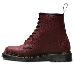 Dr Martens collabs with iconic surf brand Stussy for a variation on the original 1460 boot — and this version demands to be noticed. This 8-eye unisex limited edition boot features a classic Docs silhouette amped up with cherry pebble texture and leopard print tongue. 8-eye style Retains classic Docs DNA, with grooved edges, yellow stitching and a scripted heel-loop Cherry pebble texture Constructed on the iconic, comfortable Dr. Martens air-cushioned sole Built to last with a durable Goodyear w Black Lace-up Boots With Red Sole, Dr Martens Cherry Red, Burgundy Leather Lace-up Boots, Dark Red Doc Martens, Red Leather Lace-up Boots With Round Toe, Fred Perry Amy Winehouse, Pebble Design, Italian Hair, Surf Brands