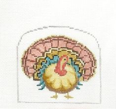 a cross - stitch turkey is shown on a white background