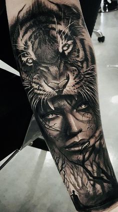 a woman with a tiger tattoo on her arm is shown in black and grey colors