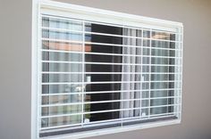 a window with blinds on the side of it