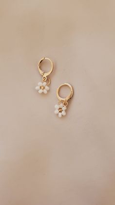 These are THE CUTEST hoop floral earrings! I personally have pretty sensitive ears and so I made sure to get good quality earrings! I've had mine in for quite a while now and I haven't taken them off during showers or while I'm sleeping. They have not rusted or caused any irritation! They are 18k plated and are super light weight. Completely hand made using Czech glass beads.  NOTE: Etsy will only allow for 2 variations. Currently I have 1 for metal and 1 for the primary color, please message me your secondary color (the center color bead) Nickel Free Hoop Earrings For Spring, Spring Small Hoop Earrings For Pierced Ears, Spring Small Hoop Earrings, Spring Dangle Hoop Earrings For Pierced Ears, Everyday Flower Charm Hoop Earrings, Spring Dangle Hoop Earrings, Everyday Flower Hoop Earrings, Everyday Flower Shaped Hoop Earrings, Dainty Hoop Earrings With Flower Charm