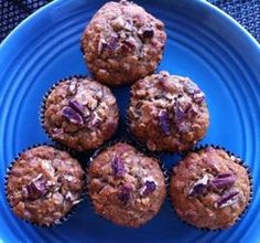 a blue plate topped with muffins on top of a table