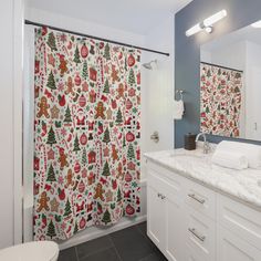 a bathroom decorated with christmas themed shower curtains