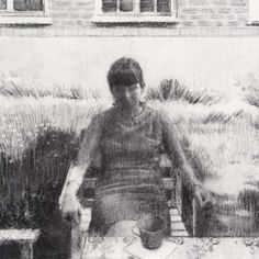 a black and white photo of a person sitting at a table with a pot on it