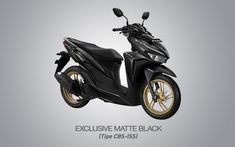 a black scooter with gold rims is shown