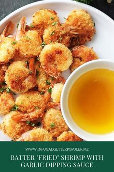 a white plate topped with shrimp and dipping sauce