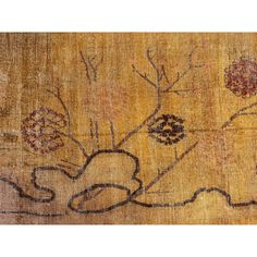 an old rug with flowers and leaves on it