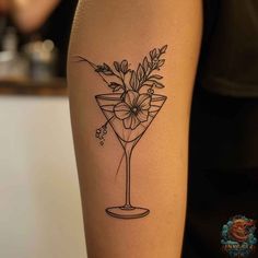 Discover the beauty of nature and mixology combined in this elegant tattoo drawing. A martini glass is artfully filled with blooming flowers and botanical elements, making it an ideal wine glass tattoo for anyone who loves hand tattoos that tell a story. Visit inktat2.com to explore more creative and personal tattoo inspirations. Wine Glass Tattoos For Women, Tattoo Inspiration Women Sleeve, Espresso Martini Tattoo, Margarita Glass Tattoo, Mixology Tattoo, Bottle Tattoo Design, Purse Tattoo, Champagne Tattoo