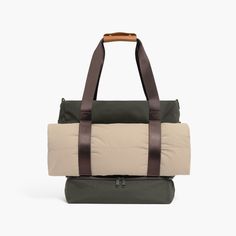 Our biggest premium do-it-all tote bag, built for maximum functionality and versatility. The waxed poly tote keeps your essentials organized for moments on the go and features a front strap velcro to carry your yoga mat or jacket. This bag is perfect for carrying everything you need for workouts, short trips or quick daily outings. Functional Tote Weekender Bag With Reinforced Handles, Functional Shoulder Bag For Weekend, Functional Nylon Travel Bag With Leather Handles, Functional Outdoor Travel Tote Bag, Functional Weekend Tote Gym Bag, Functional Tote Gym Bag For Weekend, Versatile Outdoor Travel Tote Bag, Functional Nylon Weekend Duffle Bag, Practical Nylon Tote Weekender Bag