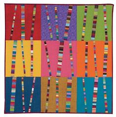 a multicolored patchwork quilt with vertical strips