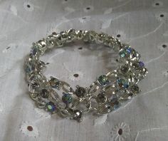 Stunning Vintage Lisner Arora Borealis Rhinestone Link Bracelet Metal Crystal Bracelet With Stones For Party, Party Crystal Bracelet With Metal Stones, Party Beaded Bracelets With Rhinestones, Party Crystal Bracelet With Stones, Crystal Rhinestone Bracelet For Party, Silver Crystal Bracelet With Stones For Party, Costume Jewelry Crystal Bracelet With Rhinestones For Party, Silver Beaded Bracelets With Sparkling Stones For Party, Party Crystal Bangle Bracelet With Stones