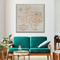 a living room filled with furniture and a large map on the wall above it's couch