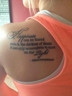 the back of a woman's arm with a quote on it