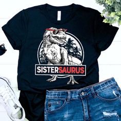 "Sistersaurus Shirt / Dinosaur Shirt / Dinosaur Gifts / Dinosaurs / Dinosaur Tshirt / Dinosaur T shirt / Dinosaur T-shirt / Dinosaur Shirts / Dinosaur Tee / Sister Saurus / Trex Shirt / T rex Shirt / T-rex Shirt / Trex Shirt / Trex Dinosaur / T rex T Shirt / T rex Shirts / Funny T-rex Shirt / Funny Trex Shirt / Dinosaur Birthday / Dinosaur Party / Dinosaur Party Shirt / Dino Shirt / Girls Dinosaur Shirt / Funny Dinosaur Shirt / Cute Dinosaur Shirt / Dinosaur Outfit / Sister Shirt / Men Women Kid Casual Dinosaur Print Tops For Streetwear, Casual Unisex Dinosaur Print Tops, Black Dinosaur Print Crew Neck Top, Cotton Dinosaur Print Tops For Streetwear, Funny Black T-shirt With Dinosaur Print, Dinosaur Tshirt, Trex Dinosaur, T Rex Shirt, Tshirt Tank Top