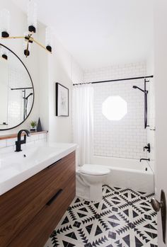 the bathroom is decorated in black and white