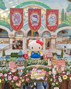 the entrance to hello kitty's easter egg shop in an amusement park with lots of decorations