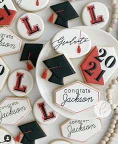 decorated cookies with graduation caps and numbers on them