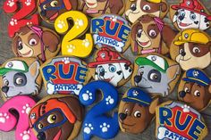 paw patrol cookies with the numbers two and four for each dog's birthday party