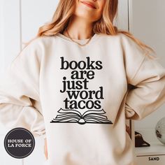 "Books are Just Word Tacos"  Book Sweatshirt This soft sweatshirt has a loose fit for a comfortable feel. :: SIZING :: - This trim-blend sweatshirt fits true to size, if you are in between sizes, we recommend sizing up - Please check out our size chart for measurements to ensure an accurate fit - No exchanges/returns for wrong size orders :: WASHING INSTRUCTIONS :: - Turn garment inside out and wash cold. - Tumble dry on low temperature setting. - Do not iron directly on the print. ::GARMENT INF Bookish Sweatshirt With Letter Print And Crew Neck, White Bookish Sweatshirt With Letter Print, Literary Long Sleeve Tops With Letter Print, Relaxed Fit Crew Neck Bookish Sweatshirt, Book Club Shirt, Librarian Shirt, Sweatshirt Fits, Club Shirts, Limassol