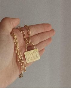 Styling is all about key items and we believe that this chain, is a key necklace. Find this love locket chain necklace on our Etsy shop. The perfect gift for her. #love #locket #jewels #jewelry #chain #goldchain #bohostyle #boho #fashion #etsy #accessories #goldaesthetic #bohoaesthetic #giftforher Gift Charm Necklace With Adjustable Rectangular Links, Charm Necklace With Adjustable Rectangular Links As Gift, Gold-tone Chain Necklace With Locket For Gift, Gold-tone Locket Chain Necklace As Gift, Gold Rectangular Pendant Necklace For Valentine's Day, Gold Pendant Chain Necklace As Gift, Gold Chain Pendant Necklace As Gift, Gold Pendant Chain Necklace For Gift, Gold-tone Chain Charm Necklace For Gift