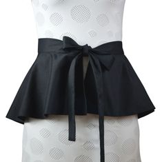 the back of a dress with a black bow on it