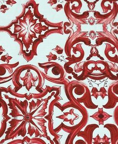 an artistic red and white design on paper