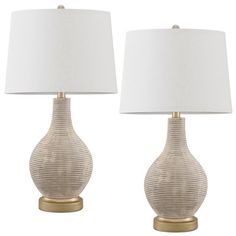 two lamps with white shades on each one