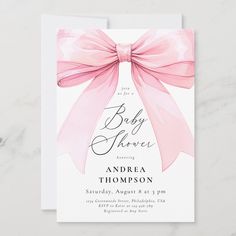 a baby shower card with a pink bow on it